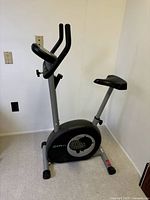 Full view of PT Fitness upright exercise bike