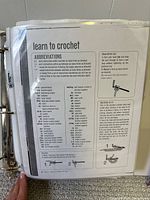 Binder cover page showing 'learn to crochet' abbreviations sheet