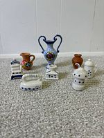 Group shot of all nine miniature items