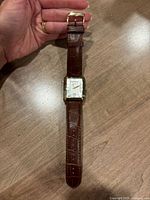 Full view of watch showing strap, case and dial