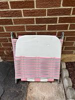 Chair folded showing webbing and frame