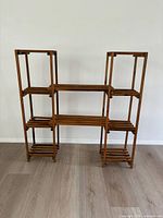 Front view of complete freestanding wooden shelving unit