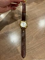 Full view of watch showing case, dial and strap