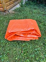 Tarp folded on lawn