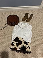 Overview of hat, boots, shirt and skirt