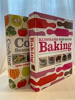 Spine view of both hardcover cookbooks standing upright