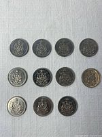 All 11 Canadian 50-cent coins laid out in rows