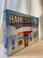 Front of sealed Hamilton-opoly game box