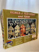 Front of box showing product name, image of finished houses, scale and model number