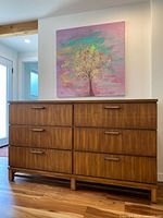 Front view of six-drawer dresser showing overall style and condition.