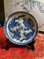 Front of saucer showing blue dragon design and rim pattern