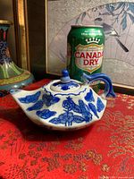 Side view of teapot with Canada Dry can for scale