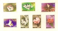 All seven Bhutan flower series stamps laid out for overview