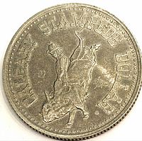 Obverse with bull-riding cowboy and CALGARY STAMPEDE DOLLAR legend