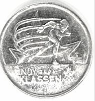 Reverse of coin showing speed skater design and legend