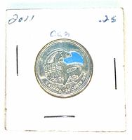 Reverse of 2011 coloured Orca 25-cent coin in holder showing blue sea and orca