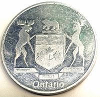 Reverse showing Ontario coat of arms, moose and deer supporters, motto banner, legend Ontario