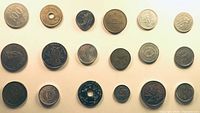 Full layout of fifteen coins arranged in three rows