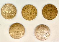 Reverse side of five 1935 Canadian one-cent coins