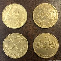 Obverse sides of four baseball-themed tokens