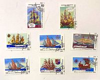 Eight Malagasy sailing-ship stamps arranged on white background