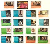 Back sides of 19 Topps Jurassic Park cards showing card numbers, text blocks and logos