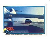 Front of card showing KITT chasing an aeroplane, Knight Rider logo and card number