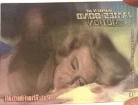 Oblique view of lenticular trading card showing title reversed due to angle