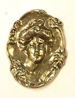 front view showing raised lady portrait and floral border