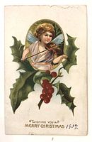 Front of postcard showing angel violinist, holly, caption
