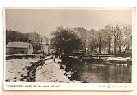 Front view of postcard image with Lock-Keeper’s House and snow scene