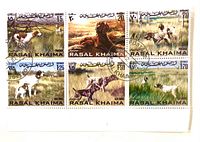 Front view of six-stamp block showing all designs and postmarks