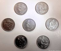 Obverse view of seven of the coins showing Trümmerfrau design