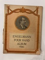 Front cover showing title, decorative border, portrait, visible spine wear