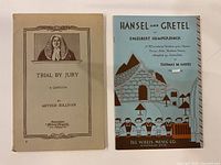 Front covers of both librettos showing titles and artwork