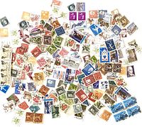 Overview of entire assortment of Swedish stamps spread out