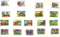 Overview of 18 Tanzanian stamps showing wildlife and soccer designs