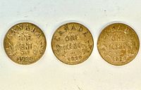 Reverse side of three 1929 Canada one-cent coins showing denomination and date
