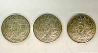 Reverse of all three coins showing dates 1928, 1929, 1932, maple leaves and denomination