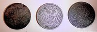 Obverse of three 10 Pfennig coins showing Imperial eagle designs with varying wear