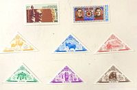 Group shot of all eight Tuva stamps showing denominations, colours and shapes