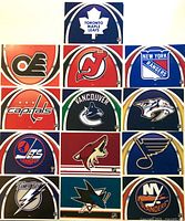 All thirteen NHL logo postcards arranged in rows