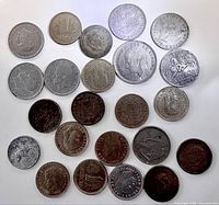 Front sides of twenty mid-century Spanish coins