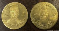 Obverse sides of both tokens showing player portraits and legends
