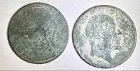 Both coins obverse sides showing green patina and worn portraits