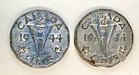 Reverse of both 1944 Victory nickels showing torch, V, maple leaves and date