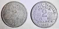 Both 1943 2 Franc coins showing reverse side with oak leaves and motto