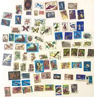 All stamps spread out showing variety of themes and denominations