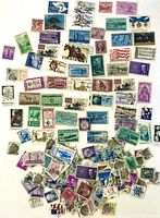 Overview of entire assortment of US stamps spread out