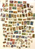 Large spread of cancelled U.S. stamps showing variety of designs and denominations